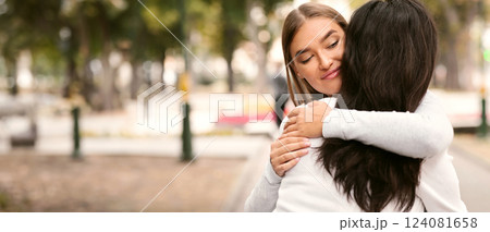 Lousy Friend. Sly Girl Embracing Desperate Girlfriend Pretending To Support Her Standing Outside. 124081658