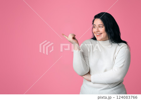 Cheerful Obese Girl Showing Aside With Finger, Pointing At Copy Space Over Pink Background, Panorama Cheerful Obese Girl Showing Aside With Finger, Pointing At Copy Space Over Pink Background, Panorama 124083766