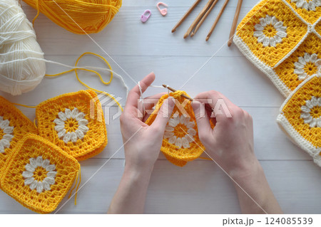 Crochet handmade granny square pattern, crocheting supplies, assorted colored wool yarn, hook, knitting crocheting 124085539