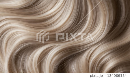 Waves of soft golden hair flow elegantly, illuminated by natural light, showcasing texture and shine. 124086584
