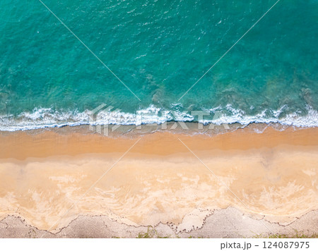 Top view Beautiful beach nature sea,Amazing landscape waves crashing on sand in summer background,Wide angle drone shot Top view Beautiful beach nature sea,Amazing landscape waves crashing on sand in summer background,Wide angle drone shot 124087975