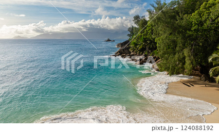 A turquoise bay with clear waters and sandy beach. Seychelles, Mahe. A turquoise bay with clear waters and sandy beach. Seychelles, Mahe. 124088192
