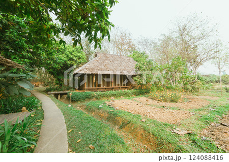 Local wooden house with tropical garden Local wooden house with tropical garden 124088416