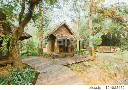 Local wooden house with tropical garden Local wooden house with tropical garden 124088432