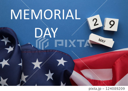 Cube calendar with date 29 May of Memorial Day with USA flag on dark blue background Cube calendar with date 29 May of Memorial Day with USA flag on dark blue background 124089209