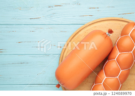 Different pork Boiled sausage on blue background. Space for text 124089970