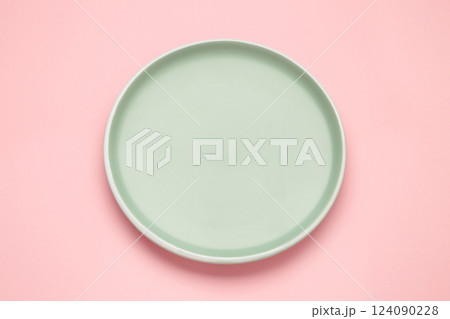 Empty mint ceramic round plate on pink background with clipping path Empty mint ceramic round plate on pink background with clipping path 124090228