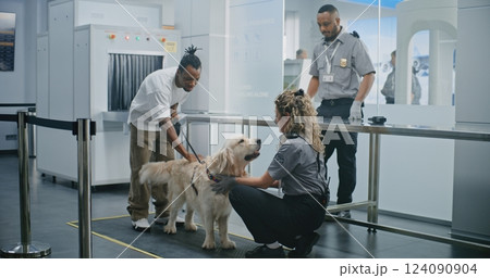 Man with Pet During Screening Procedures in Airport Terminal: Female TSA Officer Scanning Dog Man with Pet During Screening Procedures in Airport Terminal: Female TSA Officer Scanning Dog 124090904