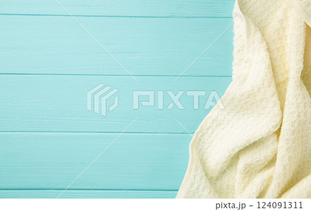 Light kitchen towel on blue wooden background Light kitchen towel on blue wooden background 124091311