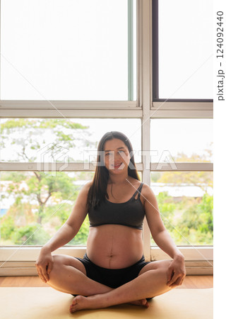 Pregnant woman doing yoga in gym Pregnant woman doing yoga in gym 124092440
