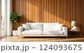 White sofa, wooden paneling, and natural wood coffee table in a minimalist living room. 124093675