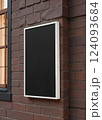 Blank black glass rectangular poster mock up brick wall mounted. 124093684