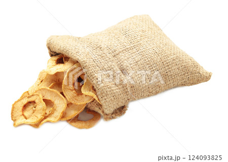 Dried apples in sock isolated on white background. Dried apples in sock isolated on white background. 124093825