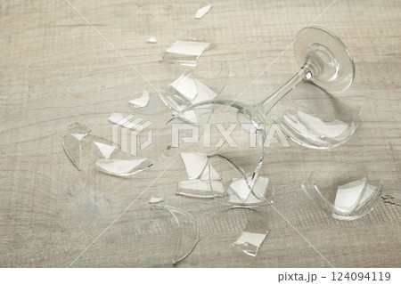 Broken wine glass on a grey background 124094119