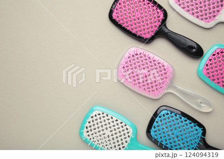 Set of hairbrushes on grey background. Flat lay 124094319