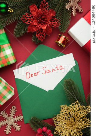 Dear Santa - letter to Santa Claus with Christmas toys on red background. Vertical photo Dear Santa - letter to Santa Claus with Christmas toys on red background. Vertical photo 124094490