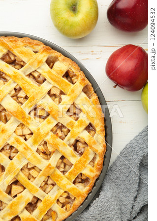 Homemade sweet american apple pie with sugar and cinnamon. Tart with apple on white background. Vertical photo 124094532