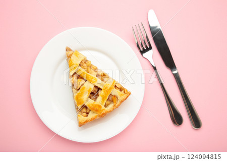 Homemade organic apple pie dessert ready to eat on pink background. 124094815