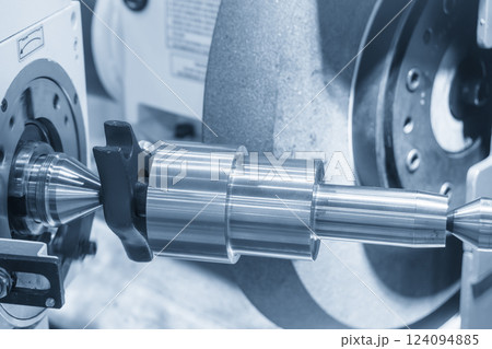 The cylindrical surface grinding machine in the light blue scene. 124094885