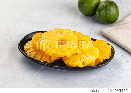 Sweet canned pineapple slices in syrope Sweet canned pineapple slices in syrope 124095525
