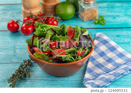 Salad with salmon and arugula Salad with salmon and arugula 124095531