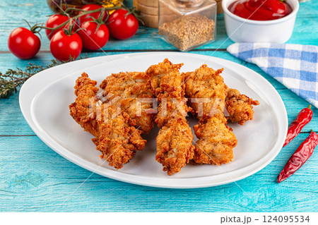 Golden crispy fried chicken strips 124095534