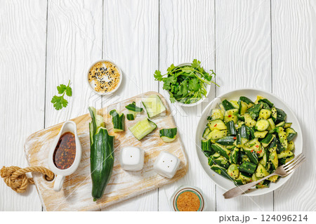Japanese smashed cucumber salad in a white bowl Japanese smashed cucumber salad in a white bowl 124096214
