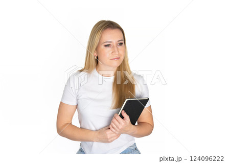 Young blonde business woman wear white shirt white t-shirt writing down in notebook diary remind memories make list dreams isolated on white background studio People lifestyle concept Young blonde business woman wear white shirt white t-shirt writing down in notebook diary remind memories make list dreams isolated on white background studio People lifestyle concept 124096222
