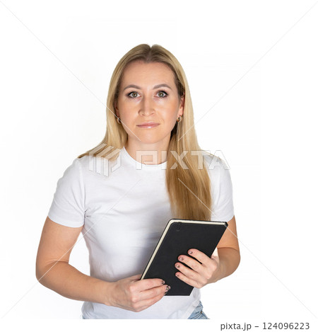 Young blonde business woman wear white shirt white t-shirt writing down in notebook diary remind memories make list dreams isolated on white background studio People lifestyle concept 124096223