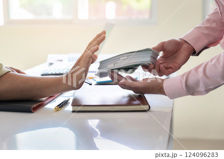 Business man refusing money to take the bribe. The concept of corruption and anti bribery. 124096283