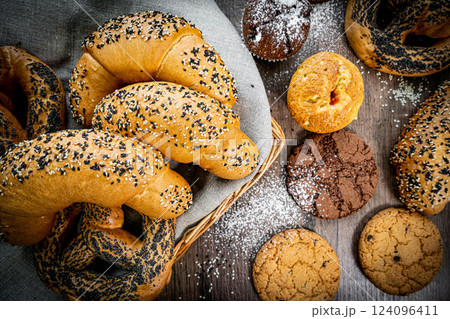 Fresh baked bread, various delicious freshly baked bread on white background, copy space. Variety of artisan bread composition, top view 124096411