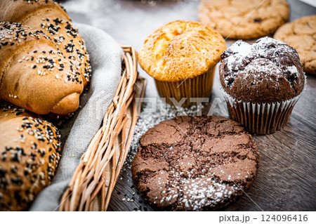 Fresh baked bread, various delicious freshly baked bread on white background, copy space. Variety of artisan bread composition, top view 124096416