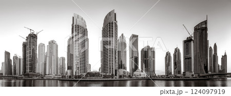 Skyscrapers and Urban city skyline over water, black and white style, city background, Dubai Marina bay UAE 124097919
