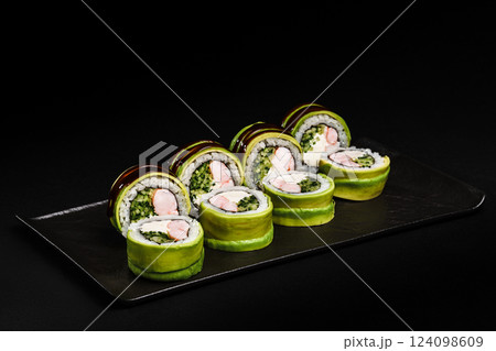 Fresh Sushi avocado shrimp Rolls Presenting Exquisitely on a Black Background Fresh Sushi avocado shrimp Rolls Presenting Exquisitely on a Black Background 124098609