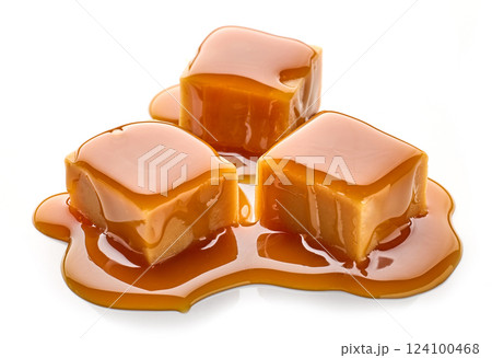 caramel candies in melted caramel sauce 124100468