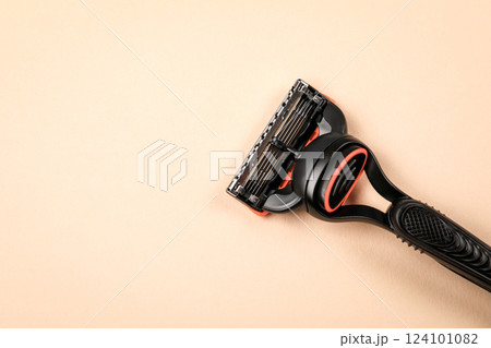 Close-up of a shaving razor on a light background, with free space for text Close-up of a shaving razor on a light background, with free space for text 124101082