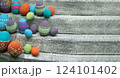 Vibrant assortment of decorative Easter eggs nestled on weathered stone steps, banner. The colorful arrangement symbolizes festive spirit of Easter 124101402