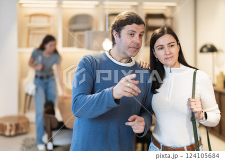 Married couple choosing furniture in a store Married couple choosing furniture in a store 124105684