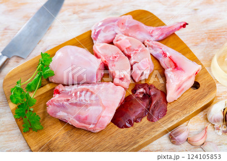 Raw rabbit meat with natural ingredients before cooking Raw rabbit meat with natural ingredients before cooking 124105853