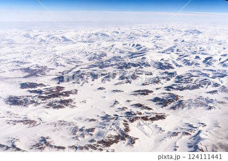 The snow-capped Tangla Mountains of the Tibetan Plateau in China, a high-altitude view from an airplane 124111441