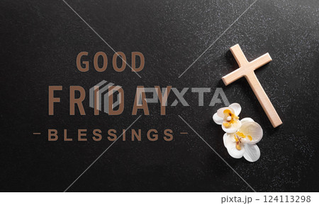 Good Friday and Holy week concept - A religious cross and flower on dark stone background. Good Friday and Holy week concept - A religious cross and flower on dark stone background. 124113298