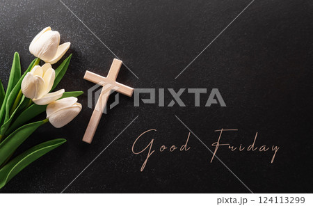 Good Friday and Holy week concept - A religious cross and flower on dark stone background. Good Friday and Holy week concept - A religious cross and flower on dark stone background. 124113299