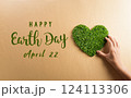 Hands holding green heart on brown background. World environment day, earth day and save earth concept. 124113306