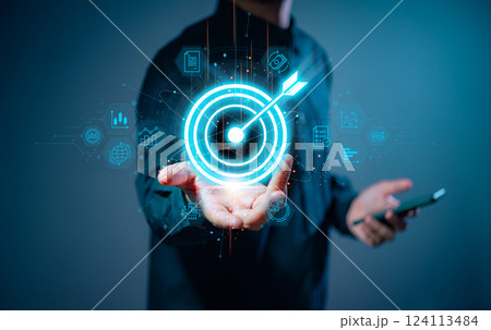 Businessman with target arrow virtual digital technology icon, business investment objectives and goals Marketing strategies and goals for success. 124113484