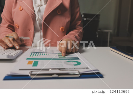 Cropped image of professional businesswoman working at her office via laptop, young female manager using portable computer device while sitting at modern loft, flare light, work process concept Cropped image of professional businesswoman working at her office via laptop, young female manager using portable computer device while sitting at modern loft, flare light, work process concept 124113695