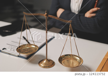 Judge gavel with Justice lawyers having team meeting at law firm background. Concepts of Law and Legal services. Judge gavel with Justice lawyers having team meeting at law firm background. Concepts of Law and Legal services. 124113732