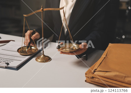 Judge gavel with Justice lawyers having team meeting at law firm background. Concepts of Law and Legal services. Judge gavel with Justice lawyers having team meeting at law firm background. Concepts of Law and Legal services. 124113766