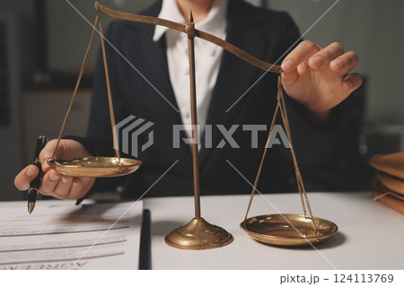 Judge gavel with Justice lawyers having team meeting at law firm background. Concepts of Law and Legal services. Judge gavel with Justice lawyers having team meeting at law firm background. Concepts of Law and Legal services. 124113769