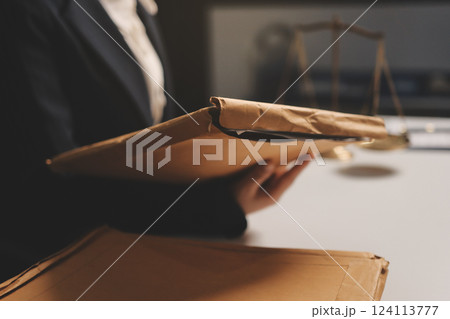 Judge gavel with Justice lawyers having team meeting at law firm background. Concepts of Law and Legal services. 124113777