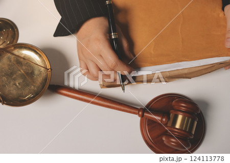 Judge gavel with Justice lawyers having team meeting at law firm background. Concepts of Law and Legal services. 124113778